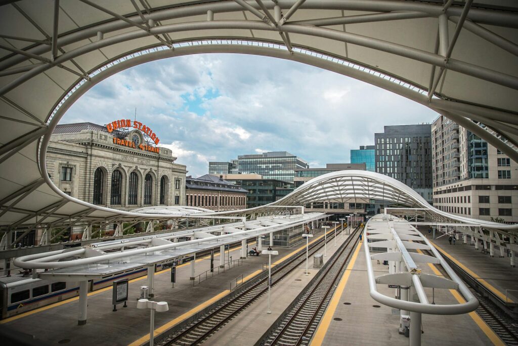 A striking view of Denver Union Station showcasing its modern architecture and urban surroundings.