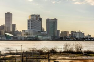 Stunning view of New Orleans skyline from across the Mississippi River at sunset.