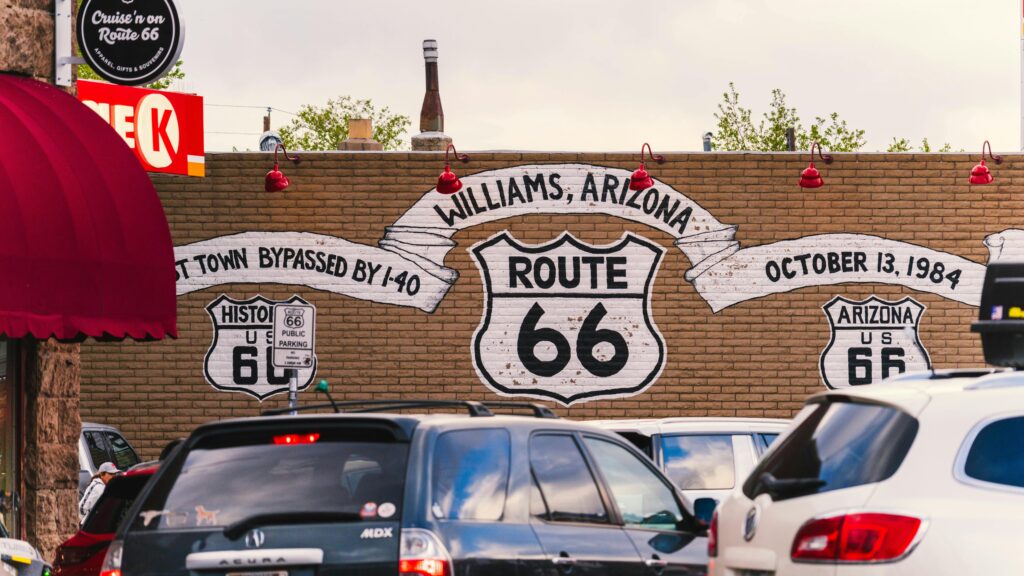 Vibrant mural celebrating Route 66 on a street in Williams, Arizona.