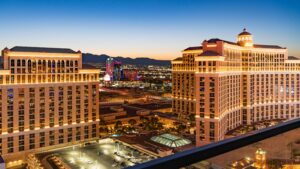 Stunning aerial view of the illuminated Bellagio Hotel and Las Vegas skyline during twilight.