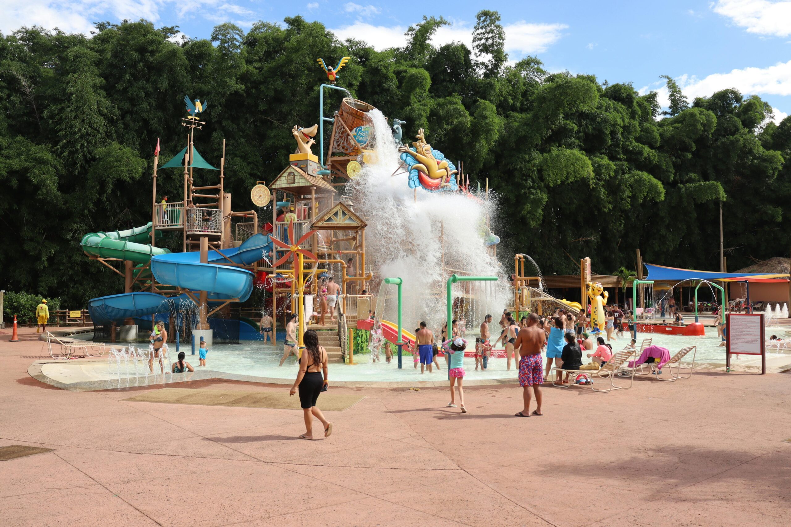 Families enjoying a lively day at Rio Quente's colorful water park with slides and splash zones.