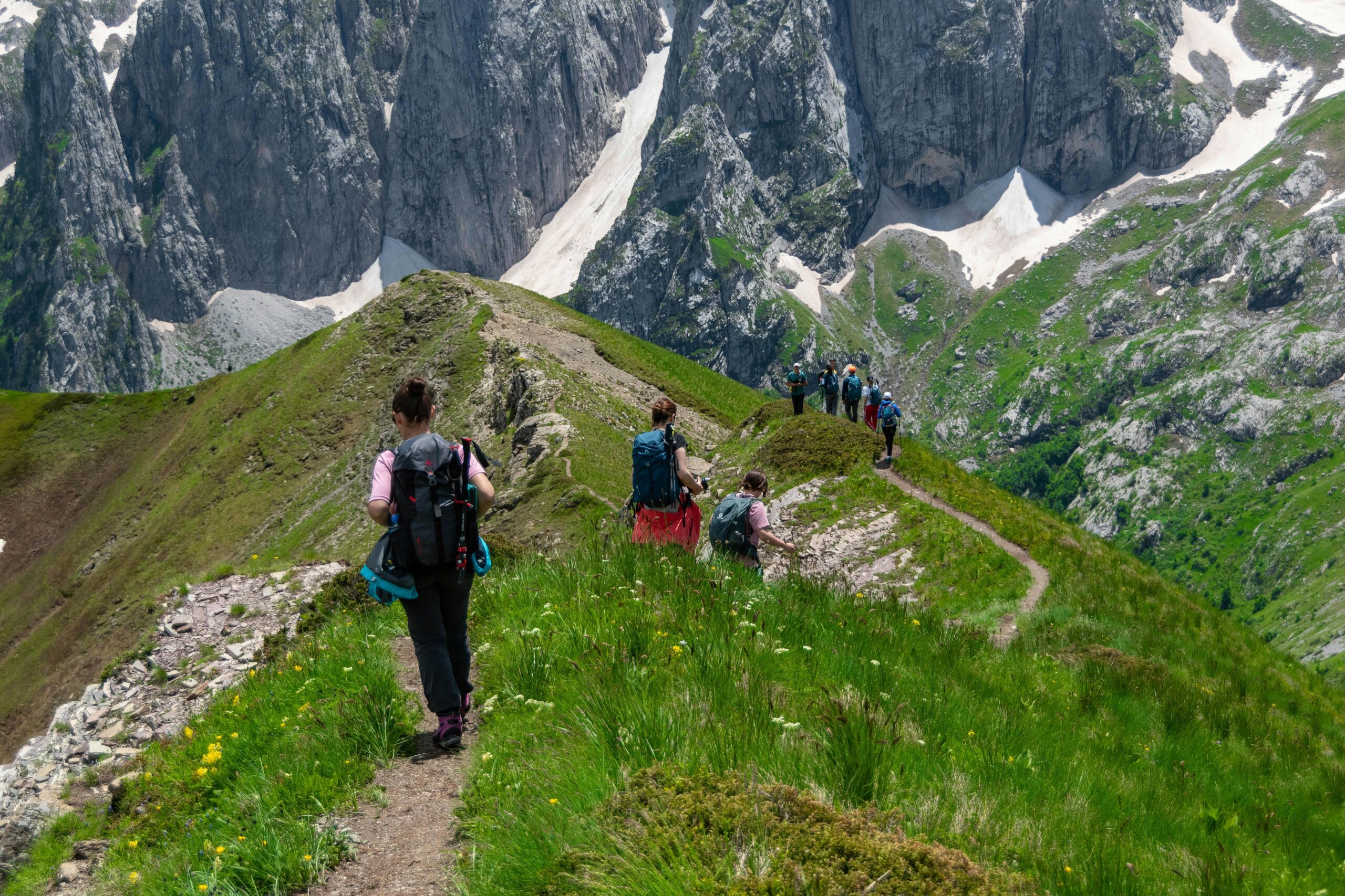 A group of hikers exploring the breathtaking mountain trails of Montenegro.