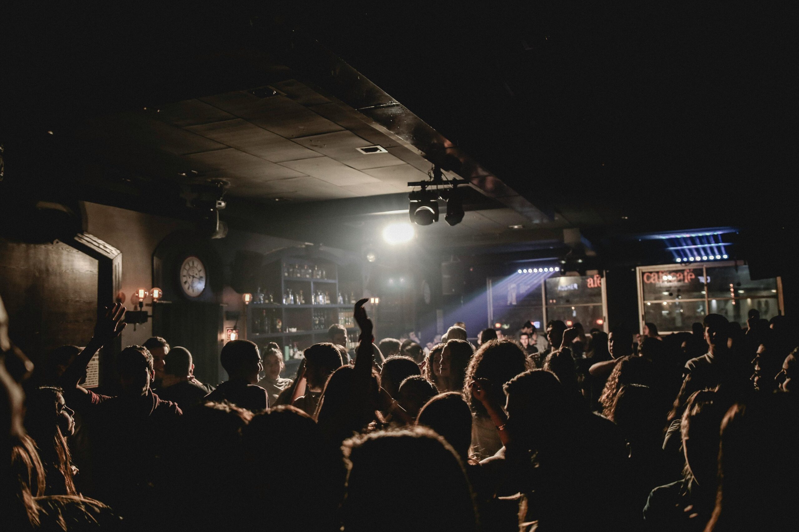 Energetic crowd enjoying a lively night out in a bustling nightclub.