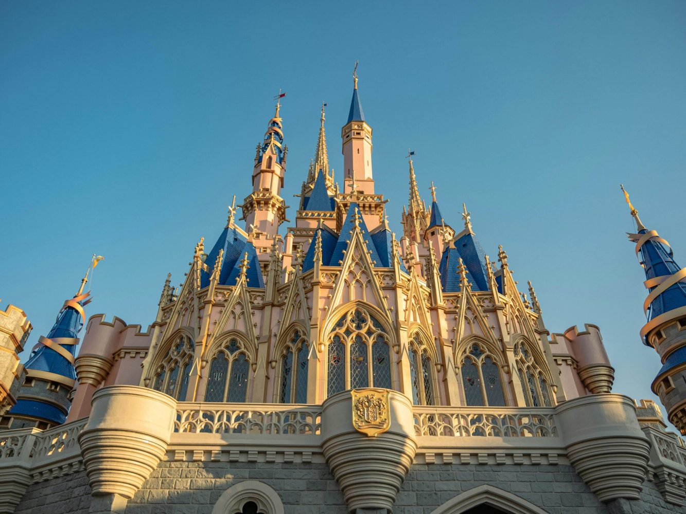 Stunning low-angle view of the iconic Cinderella Castle at Disney World, capturing its architectural beauty.